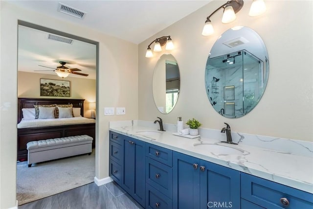 17138 Hickory Ridge Ct, Canyon Country, CA 91387 - full bathroom featuring connected bathroom, a marble finish shower, double vanity, ceiling fan, and wood finished floors