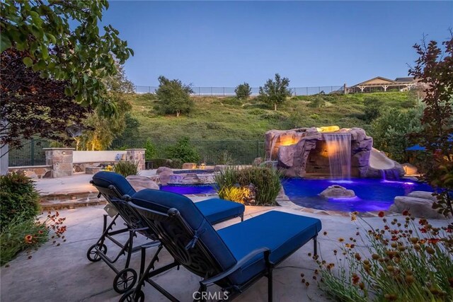 17138 Hickory Ridge Ct, Canyon Country, CA 91387 - view of patio featuring an outdoor fire pit and an outdoor pool