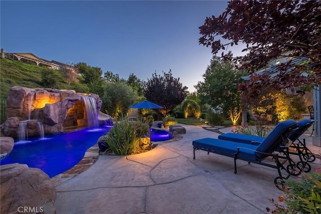 17138 Hickory Ridge Ct, Canyon Country, CA 91387 - pool at dusk featuring a patio area and a swimming pool