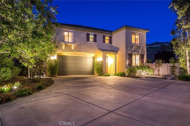 17138 Hickory Ridge Ct, Canyon Country, CA 91387 - view of front of property featuring driveway, stucco siding, and a garage