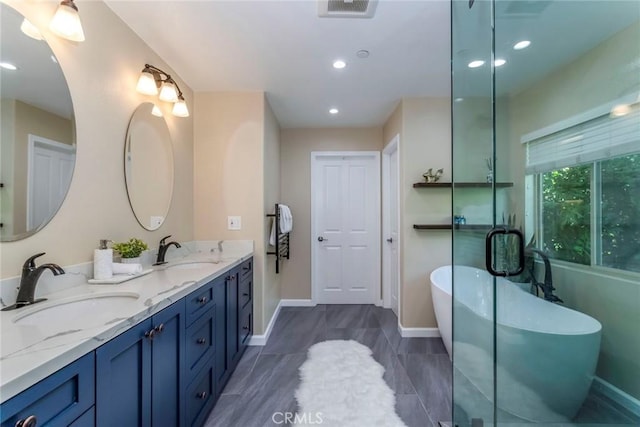 17138 Hickory Ridge Ct, Canyon Country, CA 91387 - bathroom with double vanity, a freestanding tub, and recessed lighting