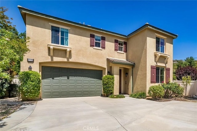 17138 Hickory Ridge Ct, Canyon Country, CA 91387 - traditional-style home featuring an attached garage, stucco siding, and concrete driveway