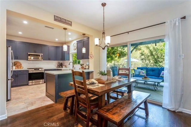 17138 Hickory Ridge Ct, Canyon Country, CA 91387 - dining space with healthy amount of natural light, recessed lighting, light wood finished floors, and a chandelier