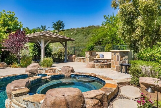 17138 Hickory Ridge Ct, Canyon Country, CA 91387 - view of swimming pool with a gazebo, a patio area, and a pool with connected hot tub