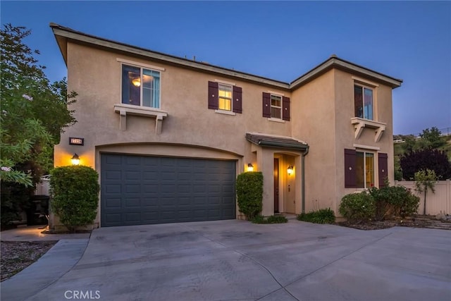 17138 Hickory Ridge Ct, Canyon Country, CA 91387 - view of front of home with stucco siding, a garage, and concrete driveway