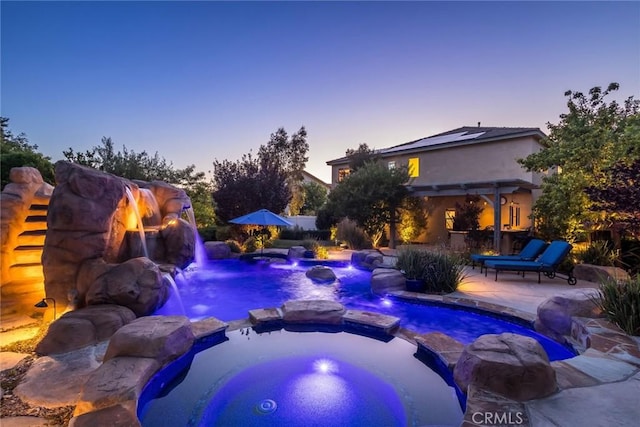 17138 Hickory Ridge Ct, Canyon Country, CA 91387 - pool at dusk with a patio area and a pool with connected hot tub