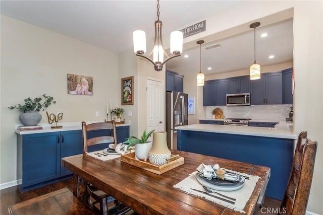 17138 Hickory Ridge Ct, Canyon Country, CA 91387 - dining room featuring a chandelier, dark wood-style floors, and recessed lighting
