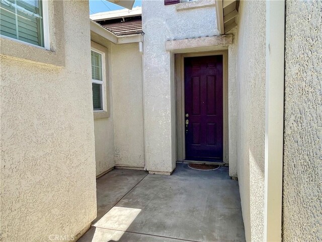 3803 Colma Ct, Merced, CA 95348 - doorway to property with stucco siding