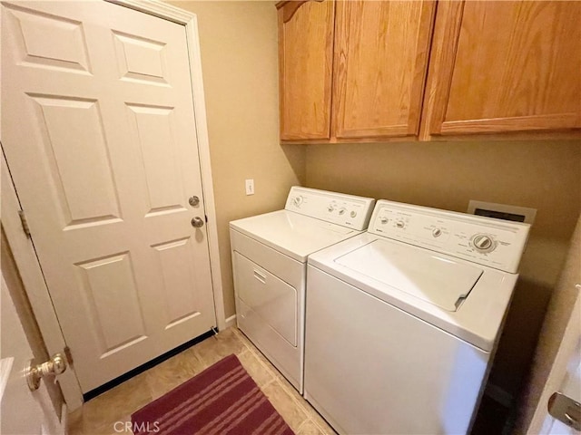 3803 Colma Ct, Merced, CA 95348 - laundry area with washing machine and dryer and cabinet space