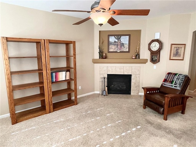 3803 Colma Ct, Merced, CA 95348 - living area with carpet floors, a ceiling fan, and a tiled fireplace