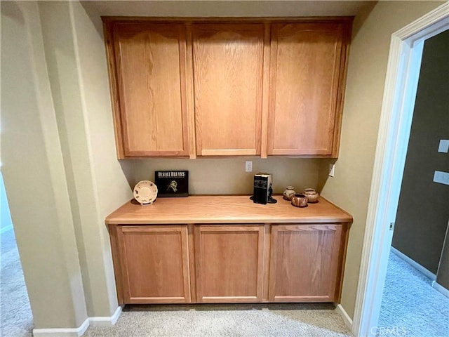 3803 Colma Ct, Merced, CA 95348 - kitchen featuring light countertops, light carpet, and light brown cabinets