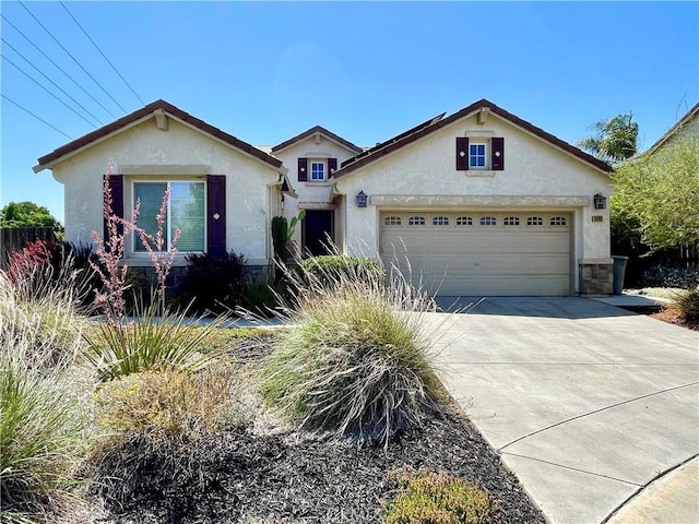 3803 Colma Ct, Merced, CA 95348 - view of front facade with stucco siding, driveway, and an attached garage