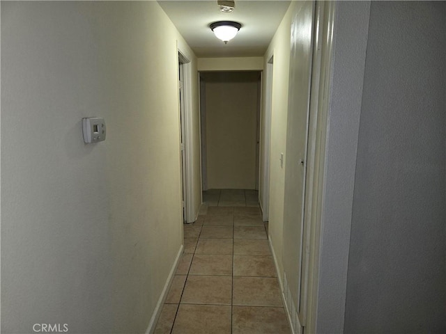 3608 Wagoner Ln, Corona, CA 92879 - hallway with light tile patterned flooring and baseboards