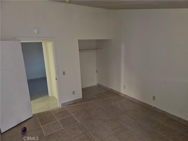 3608 Wagoner Ln, Corona, CA 92879 - unfurnished bedroom with dark tile patterned floors and a closet