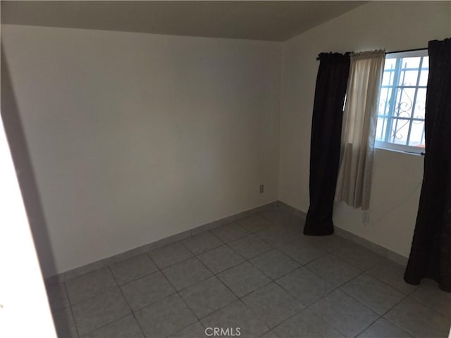 3608 Wagoner Ln, Corona, CA 92879 - spare room featuring light tile patterned flooring and lofted ceiling