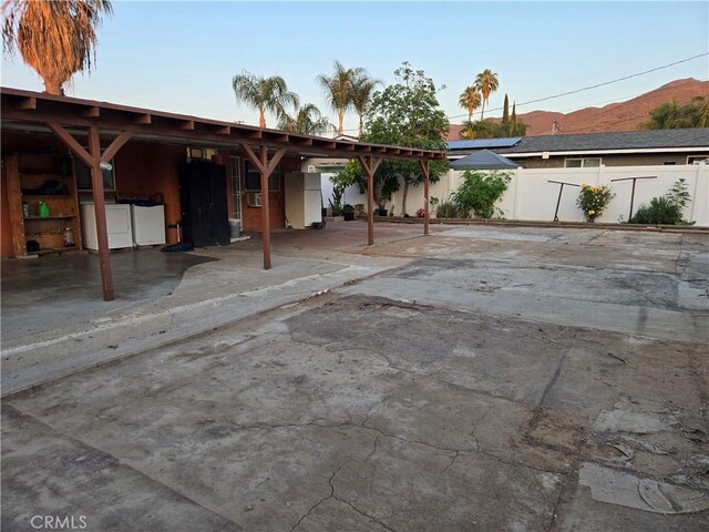 3608 Wagoner Ln, Corona, CA 92879 - view of car parking featuring washer and clothes dryer and a mountain view