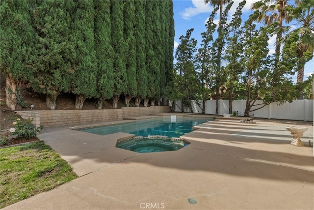 12847 Winthrop Ave, Granada Hills, CA 91344 - view of pool featuring a fenced backyard, a patio area, and a pool with connected hot tub