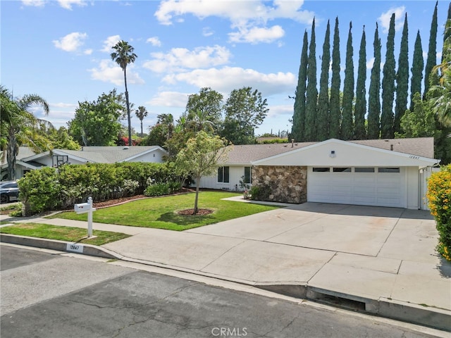 12847 Winthrop Ave, Granada Hills, CA 91344 - ranch-style house featuring a garage, a front yard, concrete driveway, and stone siding
