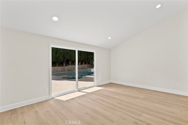 12847 Winthrop Ave, Granada Hills, CA 91344 - spare room featuring light wood-style flooring, recessed lighting, and vaulted ceiling