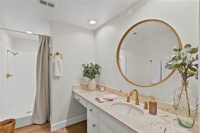 12847 Winthrop Ave, Granada Hills, CA 91344 - full bathroom featuring vanity, a shower with shower curtain, wood finished floors, and recessed lighting