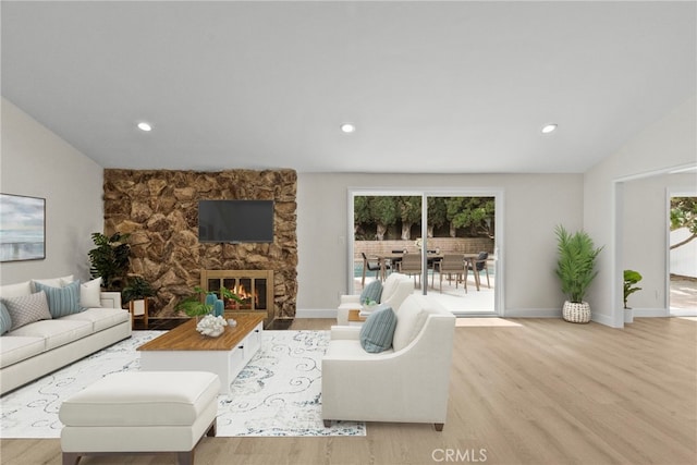 12847 Winthrop Ave, Granada Hills, CA 91344 - living area featuring light wood-style floors, vaulted ceiling, a fireplace, and recessed lighting