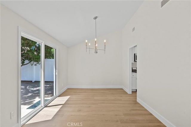 12847 Winthrop Ave, Granada Hills, CA 91344 - unfurnished dining area with a chandelier, light wood finished floors, and lofted ceiling