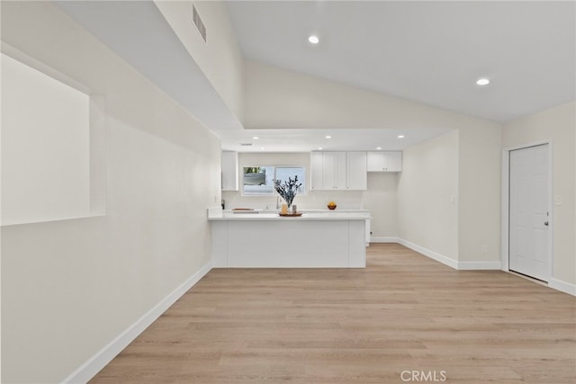 12847 Winthrop Ave, Granada Hills, CA 91344 - unfurnished living room featuring light wood finished floors, vaulted ceiling, and recessed lighting