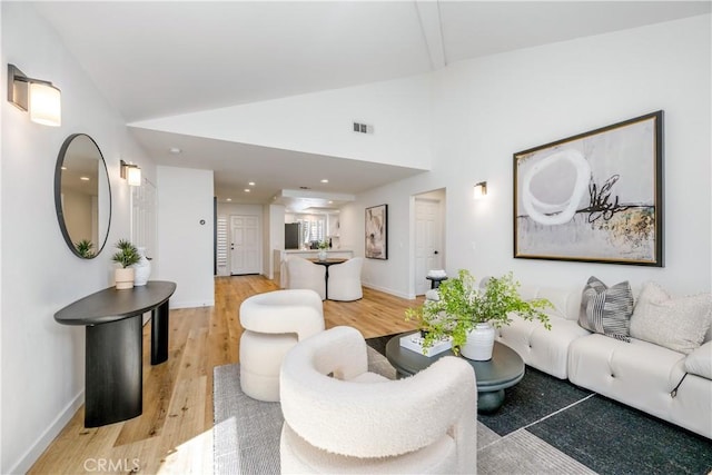 503 Morning Canyon Rd Unit 9, Corona Del Mar, CA 92625 - living room with vaulted ceiling, light wood finished floors, and recessed lighting