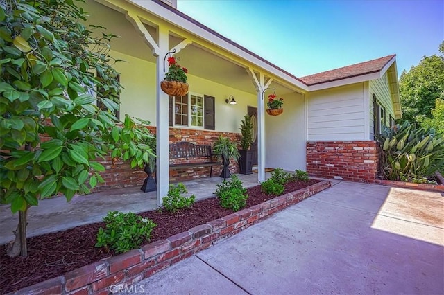 1375 N Euclid Ave, Upland, CA 91786 - view of exterior entry featuring a porch and brick siding