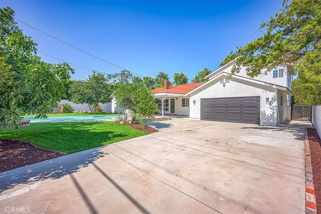 1375 N Euclid Ave, Upland, CA 91786 - view of front facade with concrete driveway, stucco siding, and an attached garage