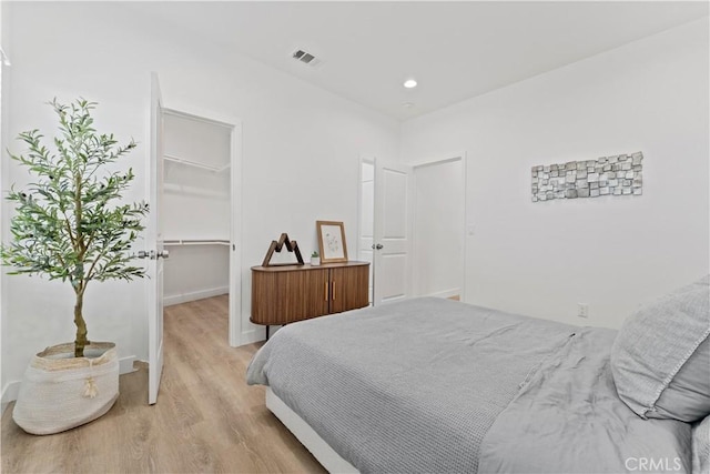 13154 Cedar St, Westminster, CA 92683 - bedroom featuring a spacious closet, light wood finished floors, a closet, and recessed lighting
