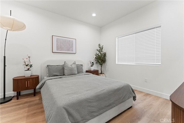 13154 Cedar St, Westminster, CA 92683 - bedroom with light wood-style flooring and recessed lighting