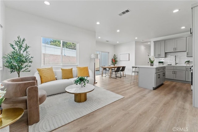 13154 Cedar St, Westminster, CA 92683 - living room with light wood-style flooring and recessed lighting
