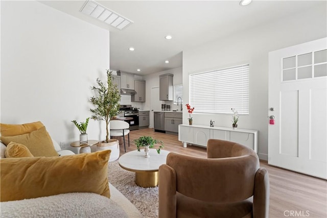 13154 Cedar St, Westminster, CA 92683 - living area featuring light wood-style floors and recessed lighting