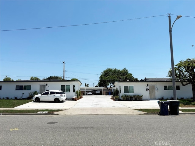 13154 Cedar St, Westminster, CA 92683 - view of front facade featuring driveway and stucco siding