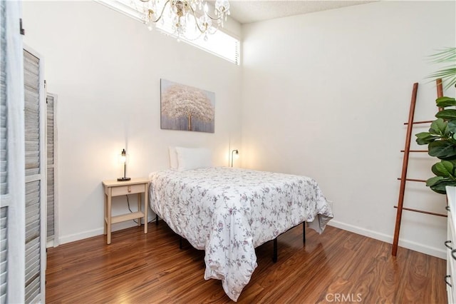 9 Morena Unit 28, Irvine, CA 92612 - bedroom with a chandelier and wood finished floors