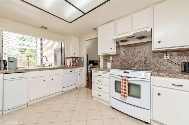 9 Morena Unit 28, Irvine, CA 92612 - kitchen with white appliances, under cabinet range hood, white cabinets, and decorative backsplash