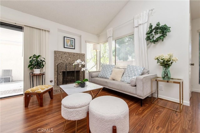 9 Morena Unit 28, Irvine, CA 92612 - living area featuring vaulted ceiling, wood finished floors, and a premium fireplace