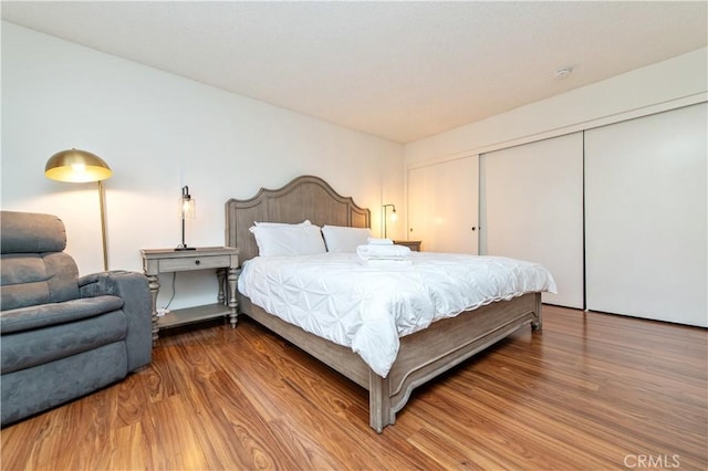9 Morena Unit 28, Irvine, CA 92612 - bedroom with wood finished floors and a closet