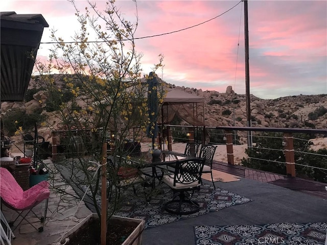 56564 Nelson Ave, Yucca Valley, CA 92284 - view of patio / terrace featuring a mountain view and outdoor dining space