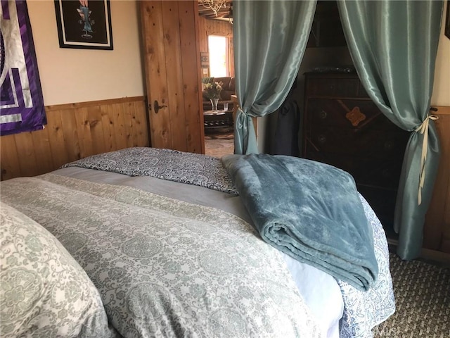 56564 Nelson Ave, Yucca Valley, CA 92284 - bedroom featuring wood walls and wainscoting