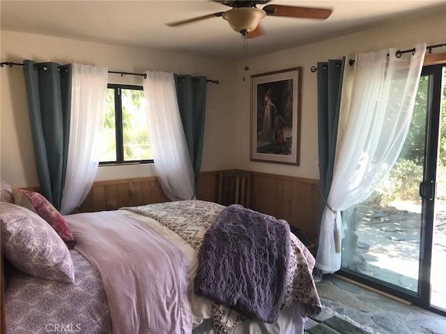 56564 Nelson Ave, Yucca Valley, CA 92284 - bedroom featuring multiple windows, ceiling fan, and access to exterior