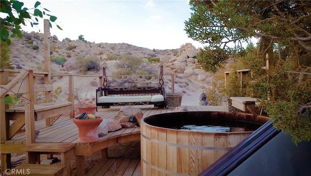 56564 Nelson Ave, Yucca Valley, CA 92284 - view of patio with a deck with mountain view and an outdoor hot tub