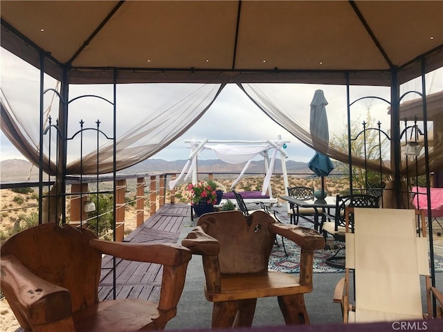 56564 Nelson Ave, Yucca Valley, CA 92284 - sunroom featuring a mountain view and carpet