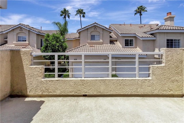 27982 Via Del Agua, Laguna Niguel, CA 92677 - view of front facade with stucco siding, a tile roof, and a garage