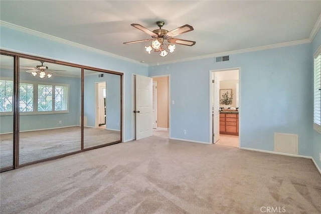 17654 Prairie St, Northridge, CA 91325 - unfurnished bedroom with ornamental molding, carpet flooring, a closet, connected bathroom, and a ceiling fan