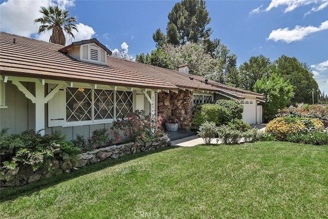 17654 Prairie St, Northridge, CA 91325 - view of front of house with a front yard, a garage, a chimney, and board and batten siding