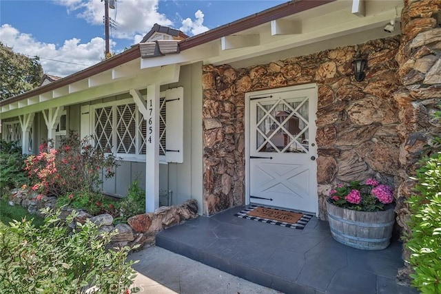17654 Prairie St, Northridge, CA 91325 - doorway to property featuring stone siding