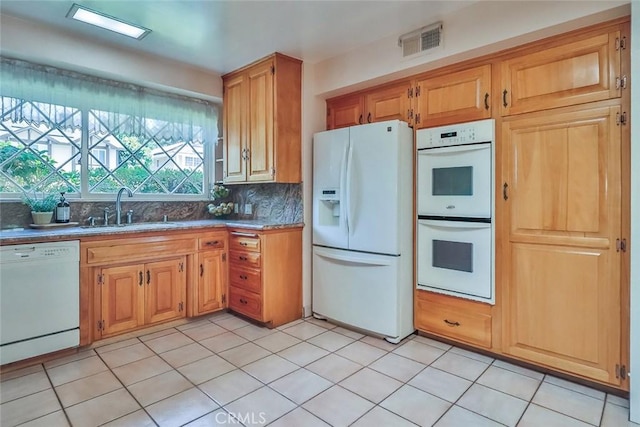17654 Prairie St, Northridge, CA 91325 - kitchen with white appliances and backsplash
