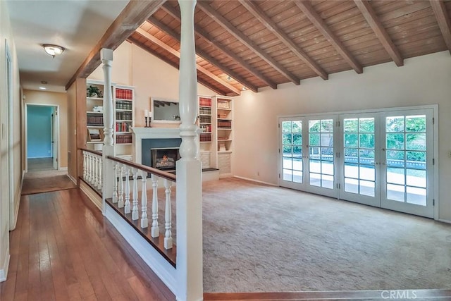 17654 Prairie St, Northridge, CA 91325 - unfurnished living room with a wood ceiling with exposed beams, a lit fireplace, decorative columns, high vaulted ceiling, and wood-type flooring